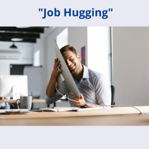 A man hugging his computer at work with the caption "Job Hugging"